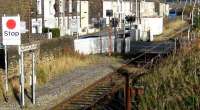 Chaffers level crossing, just east of Nelson station, where the driver must pull the cord on the board next to the <I>STOP</I> sign in order to activate the crossing warning lights and barriers, following which he obtains a white proceed light. Once his train has cleared the crossing the barriers are then raised automatically. I have not come across any other examples of a crossing operated in this way other than at stations where a train is scheduled to stop anyway, eg Kirknewton [see image 13900], or on some freight-only lines.<br><br>[John McIntyre 08/11/2007]