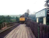 A class 25 brings a train for the far north across the Oykel Viaduct over the Kyle of Sutherland and into Invershin station in the early 1970s. <br><br>[Ian Dinmore //]