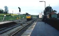 A class 47 approaching Castle Cary with a train from Weymouth in May 1985. The train is about to join the GW main line coming in from the Taunton direction.<br><br>[John McIntyre 22/05/1985]