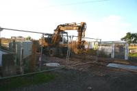 Scene at Kincardine station level crossing on 29 November 2007. To the left is the old station and platform remains, to the right is the entrance to the site of the former Kincardine Power Station. Part of the Kincardine Bridge can be seen beyond the station site, while in the right background construction work continues on the new upper Forth crossing.<br><br>[John Furnevel 29/11/2007]