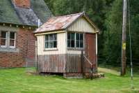 Former signal box standing at the east end of The Mound station in August 2007. Part of the old station building can be seen on the left  while todays trains on the far north line now pass non-stop through the platform beyond the wire fence at the rear of the box.<br><br>[John Furnevel 26/08/2007]