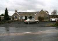 Six miles north of Hexham (as the crow flies) stands the village of Chollerton. View west over the road junction in the village centre on 5 November 2007, looking towards the old Border Counties station.<br><br>[John Furnevel 05/11/2007]