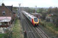 A southbound Voyager, having just run through Gretna Junction, heads south past the former Gretna station and on towards Carlisle on a wet 6 November. <br><br>[John Furnevel 06/11/2007]