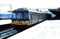 303 001 repainted in Blue Train livery for the 25th anniversary of the North Clyde Electrics, photographed at a snowy Dumbarton Central in December 1985.<br><br>[David Panton /12/1985]