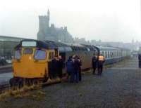 The very last goods train at Fraserburgh on the 5th October 1979. Jim Morrison, one-time signalman at Fraserburgh, and latterly railwayman at Maud is pointing out something of interest to the driver of 27020. The location of the long since demolished signal box perhaps?<br><br>[John Williamson 05/10/1979]