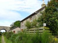 The fine building at the former Newseat halt on the Maud to Peterhead line has been restored as a private dwelling. The mile-post finishes it off nicely. View looking west on 1 Sepember 2007.<br><br>[John Williamson 01/09/2007]