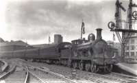 A Manson Class 336 departing St Enoch as LMS No 14217. This locomotive was built for the Glasgow and South Western Railway in 1899 as engine No 350, (later renumbered No 364/19). One of J Mansons (G&SW chief engineer at the time) Greenock Bogies, so called because it was built for the steep grades of the G&SW line to Greenock Princes Pier. Photo is undated, but likely to have been taken in the late 1920s or early 1930s as the engine was withdrawn in 1932, suffering the same fate as many G&SW engines of the period and being scrapped as non standard. Photograph taken by A C Roberts.<br><br>[Graham Morgan Collection //]