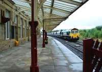 Southbound coal train at Hellifield in October 2007. View looking back along the platform towards Settle Junction.<br><br>[Ewan Crawford /10/2007]