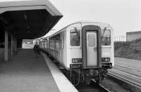 A lone passenger strolls along the platform at Larne Harbour before boarding a train for Belfast in 1988.<br><br>[Bill Roberton //1988]