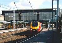 A Voyager for Edinburgh Waverley stands at Carlisle on 19 September 2006. On the left a 156 service ready to leave for Glasgow Central via the G&SW route waits in the bay for the Voyager to depart after which it will follow it north as far as Gretna Junction.<br><br>[John McIntyre 19/09/2006]