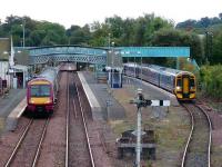 A Glasgow Queen Street 170 service stands at platform 1 at Dunblane on 25 August while a 158 from Edinburgh leaves platform 3 for the reversing siding.<br><br>[David Panton 25/08/2007]