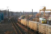 EWS 60500 takes the returning <I>Binliner</I> containers past what could eventually become their new home if plans to create a new refuse disposal facility on the site of the former Portobello Freightliner depot become a reality. Meantime its a case of <i>onward to Powderhall</i>. December 2007. [Note: Planning permission to build the new facility here was subsequently refused (no pun intended)  by Edinburgh Council in July 2008.]<br><br>[John Furnevel 16/12/2007]