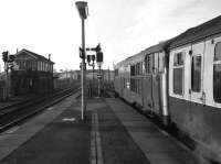 A class 31 stands in the bay at Cambridge with a service for London, Liverpool Street on 18 January 1976. Cambridge South box controls a mix of cls and semaphores around the station at the time.<br><br>[John McIntyre 18/01/1976]