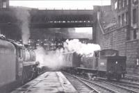 73105 at Queen Street waiting to depart, while 69188 arrives with a West Highland Line service. Photo taken on 13th April 1961, but photographer unknown<br><br>[Graham Morgan Collection 13/04/1961]