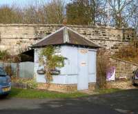 Old railway building, thought to have been used as a lamp room, still standing at Scotsgap, the junction station on the Wansbeck line for the Rothbury branch. The line from the Junction came in under the bridge carrying the B6343 road, with the station itself just off picture to the right. View north west on 8 November 2007.<br><br>[John Furnevel 08/11/2007]