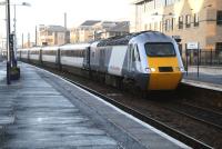 The National Express East Coast 0950 Aberdeen-Kings Cross HST arrives at Haymarket platform 1 on a freezing 20 December 2007, headed by power car 43300 <I>Craigentinny</I>. This is the first set to appear in full NXEC livery with the majority of ex-GNER liveried stock currently carrying the white stripe.<br><br>[John Furnevel 20/12/2007]