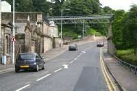 Remains of the overbridge that once brought the branch into Kirkcaldy Harbour, now carrying pipelines serving the remaining industrial establishments in the area. View northeast towards Dysart on 22 July 2007.<br><br>[John Furnevel 22/07/2007]