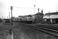 A class 47 takes a container train north towards Aberdeen through the site of the former Cove station on 07 December 1974.<br><br>[John McIntyre 07/12/1974]