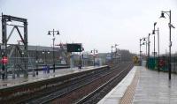 New Starting signal on the main up platform at Stirling installed in May 2007. Stirling Middle signal box is passed by a Dunblane class 158 dmu. The new bridge support on the left is for a footbridge accross the station from the city to Forthside housing and liesure development.<br><br>[Brian Forbes 27/12/2007]