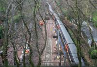 Looking at first glance like the aftermath of a derailment, the 1150 NXEC Glasgow Central - London Kings Cross meanders slowly past engineering works in Princes Street Gardens to enter The Mound north tunnel, directly below the camera, on 28 December 2007. The works are in connection with the electrification of the central tunnel as well as the remaining Waverley west end platforms.<br><br>[John Furnevel 28/12/2007]