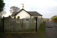 The converted station house at Kincardine on 18 December - note the small memento attached to the gate. The level crossing that once gave access to the south side of the former Kincardine power station is down the lane to the right and on the horizon beyond is the deck of the new bridge over the Forth.<br><br>[John Furnevel 18/12/2007]