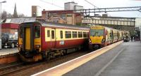 156504 has just arrived at Motherwell on 2 January 2008 with a train from Cumbernauld, while 334012, having come in from Milngavie via Hamilton, is about to leave with a service for Lanark. <br><br>[John McIntyre 02/01/2008]