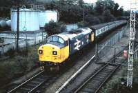 Having just left Fort William, 37 111 passes the West Highland oil terminal on the approach to the former Mallaig (now Fort William) Junction in September 1985.<br><br>[David Panton /09/1985]