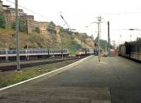 East end of Waverley in July 1991 looking along the present (January 2008) platform 4. An InterCity 125 is leaving for the south while on the right a class 08 shunts Motorail vehicles. Over on the left in the siding stands one of the class 305 emus imported from Essex and used at that time on the North Berwick line.<br><br>[John McIntyre 06/07/1991]