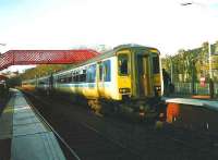 A 4-car 156 set for East Kilbride halted at Giffnock on 1 March 1999.<br><br>[David Panton 01/03/1999]