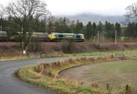 A Freightliner class 66 hauls bulk coal empties north along the WCML at Lamington in November 2007 under low cloud.<br><br>[John Furnevel 26/11/2007]