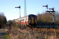 Glasgow bound service passing Lugton. Lugton is likely to become the location of a long <i>dynamic loop</i> (meaning trains do not have to slow to enter the loop I gather) to assist an increase of frequency of trains between Glasgow and Kilmarnock.<br><br>[Ewan Crawford 03/01/2008]