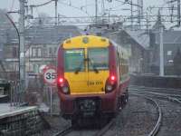 334013 departing Paisley Gilmour Street in the rain heading for Glasgow Central <br><br>[Graham Morgan 14/01/2008]