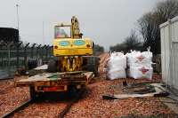 Loading up supplies to deliver them along the new Alloa line. Lots of work still required at level crossings.<br><br>[Ewan Crawford 05/01/2008]