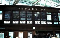 Manual departure board at Glasgow Central in May 1985 with <I>The Wee Man</I> himself caught on camera. [See image 26400]<br><br>[David Panton /05/1985]