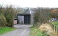 The old goods shed at Canonbie on the Langholm branch, still in use in November 2007. View south from the main road.<br><br>[John Furnevel 03/11/2007]
