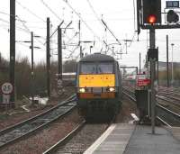 The 1150 National Express East Coast Glasgow Central - London Kings Cross service comes off the Carstairs line and runs into platform 3 at Haymarket station on 8 January 2007, just as the snow begins to fall.<br><br>[John Furnevel 08/01/2008]