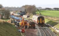 Widening work underway in connection with the Annan - Gretna redoubling project approximately one mile west of Gretna Green station in November 2007. View is towards Annan as a Carlisle - Glasgow Central service eases slowly past the activities. <br><br>[John Furnevel 06/11/2007]