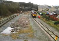 View east from the footbridge at Chinley station on the ex Midland route through the Peak District from Manchester to St Pancras on Sunday 27 January 2008. Weekend permanent way work is in progress as 66178 awaits permission to move forward with a track recovery and spent ballast train.<br><br>[John McIntyre 27/01/2008]