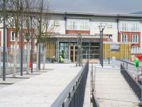 The main tree-lined pedestrian entrance to Alloa station running north from the A907 ring road on 28 January 2008. View shows the Andy Scott sculpture <I>Looking to the future</I> standing in front of the station building where work is still in progress. The new flats on the other side of the line seem to be almost complete. <br><br>[John Furnevel 28/01/2008]