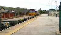 66178 heads west through Chinley station towards Manchester with recovered track panels during weekend engineering works on Sunday 27 January 2008.<br><br>[John McIntyre 27/01/2008]