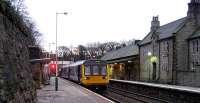 Pacer 142040 stands at New Mills Central in the High Peak district of Derbyshire on 27 January 2008. The normal Manchester - Sheffield service was being terminated here due to weekend engineering works on the line and the Pacer is preparing for the return journey to Piccadilly.<br><br>[John McIntyre 27/01/2008]