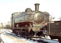 One of the ex-GWR 5700 class pannier tanks purchased by London Transport, following their withdrawal by BR, for use on PW trains. The  locomotives were allocated to the LT depots at Lillie Bridge and Neasden, where this photograph of L90 (formerly GWR 7760) was taken on a snowy Saturday morning in February 1969. The last example was withdrawn by LT in 1971. <br><br>[John Furnevel 08/02/1969]