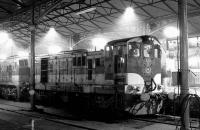 CIE 133 stands under the floodlights at the buffer stops at Heuston station, Dublin, during an evening in 1988.<br><br>[Bill Roberton //1988]