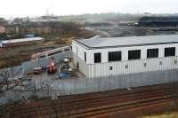 Cumbernauld - Glasgow service takes the Cowlairs Chord past the site of the new maintenance and signalling centres at Cowlairs.<br><br>[Ewan Crawford 02/02/2008]