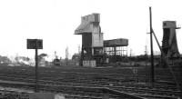 View of Carnforth from a Barrow - Preston train entering the station on 30 May 1972. The smoke to the left of the coaling tower is from preserved Ivatt 2-6-0 6441 which was moving down the yard from the old MPD.<br><br>[John McIntyre 30/05/1972]