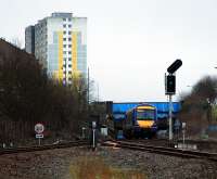 Queen Street bound at Cowlairs South Junction. Is that the gable end (left) which once bore a mural?<br><br>[Ewan Crawford 02/02/2008]