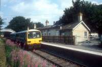 A Sunday excursion special heads southeast through Stanhope on the former Wearhead branch in August 1988 on its way back to Saltburn. <br><br>[Ian Dinmore /08/1988]