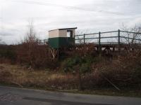 Llandecwyn Halt from the adjacent road looking westwards towards the estuary and showing the stilt construction supporting the platform and shelter of this small Cambrian Coast line halt.<br><br>[Mark Bartlett 03/02/2008]