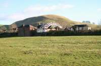 Across the fields from the B6405 road stands the old station at Hassendean on the Waverley route. The privately owned property is seen here looking east on 6 February 2008. <br><br>[John Furnevel 06/02/2008]