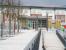 The main tree-lined pedestrian entrance to Alloa station running north from the A907 ring road on 28 January 2008. View shows the Andy Scott sculpture <I>Looking to the future</I> standing in front of the station building where work is still in progress. The new flats on the other side of the line seem to be almost complete. <br><br>[John Furnevel 28/01/2008]